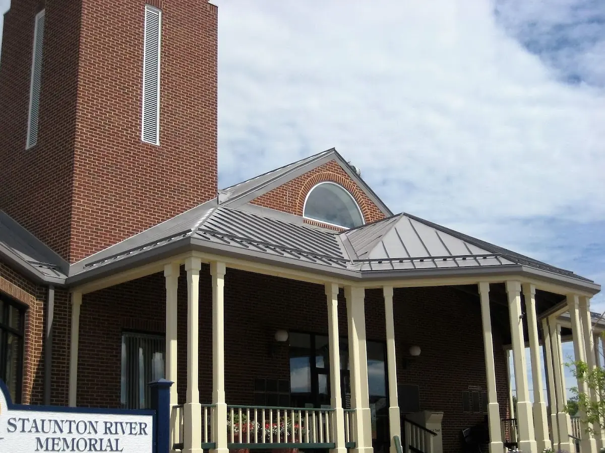 Skilled roofing craftsmen working on a residential roof in Durant